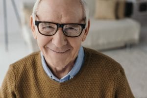 man with glasses smiling