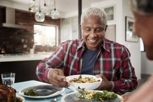 Couple enjoying a meal around the table