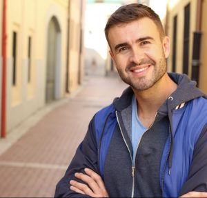 man smiling in the street