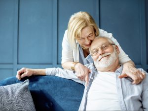 senior couple embracing on the couch