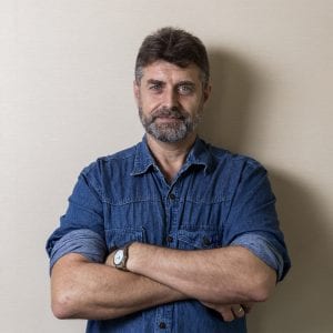 man standing with his arms crossed