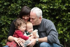 family embracing outside
