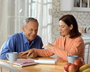 couple sitting at the kitchen table laughing