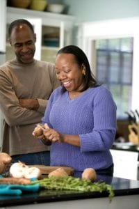happy couple cooking