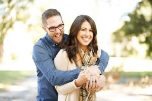 smiling couple embracing in the park