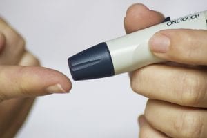 patient checking their blood sugar